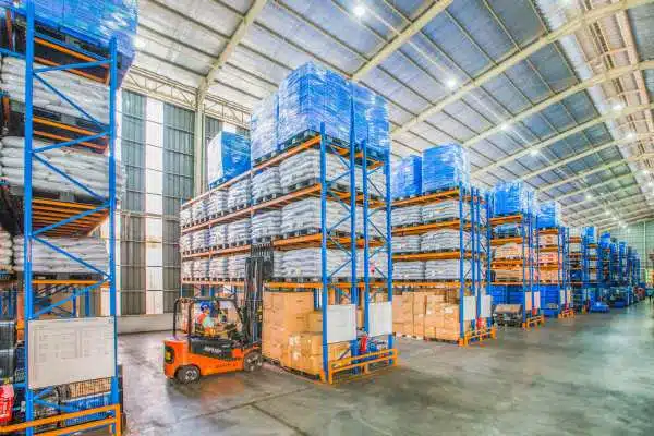 Cold storage warehouse with pallet racking and forklift where temperature is monitored by data loggers